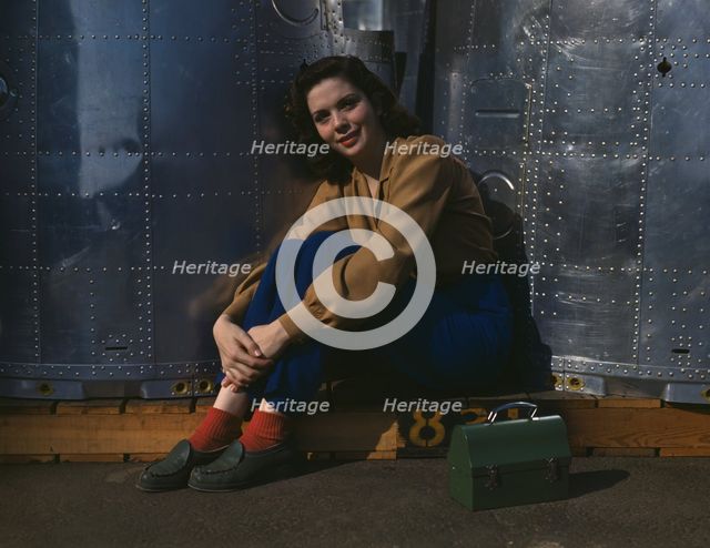A noontime rest for a full-fledged assembly worker...Long Beach, Calif. Plant of Douglas..., 1942. Creator: Alfred T Palmer.