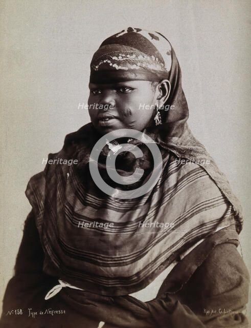 A North African woman with scarification on her cheeks, c1900. Creator: Gabriel Lekegian.
