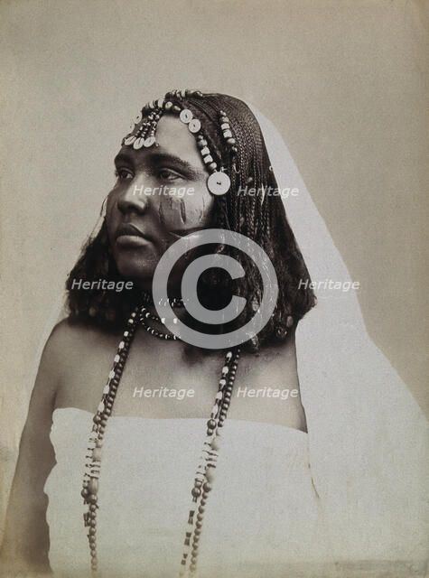 A North African woman with scarification on her cheeks, c1900. Creator: Gabriel Lekegian.