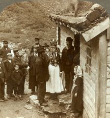 A Nordfjord bride and groom with guests and parents at house door, Brigsdal, Norway c1905. Creator: Unknown