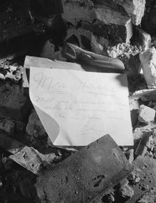 A note left in a wrecked house on Independence Avenue, Washington, D.C, 1942. Creator: Gordon Parks