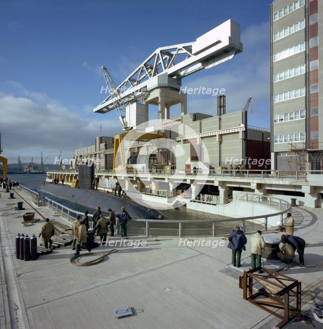 A nuclear submarine berthing at Devonport docks, Plymouth, Devon, 1980. Creator: Michael Walters.
