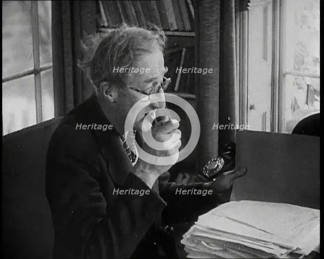 A.P. Herbert Inspecting Some Papers, 1930s. Creator: British Pathe Ltd.