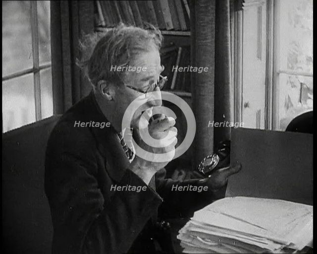 A.P. Herbert Inspecting Some Papers, 1930s. Creator: British Pathe Ltd.