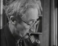A.P. Herbert Smoking a Pipe, 1930s. Creator: British Pathe Ltd