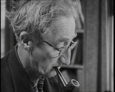 A.P. Herbert Smoking a Pipe, 1930s. Creator: British Pathe Ltd
