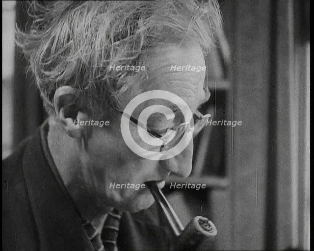 A.P. Herbert Smoking a Pipe, 1930s. Creator: British Pathe Ltd.
