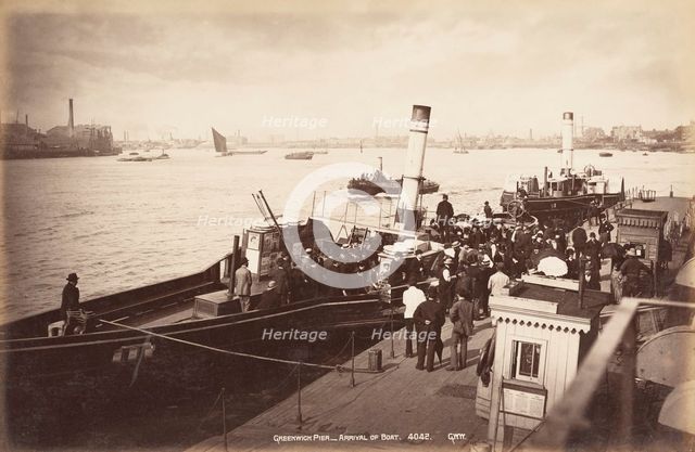 A paddle steamer disembarking passengers at Greenwich Pier, London, c1890. Artist: Unknown