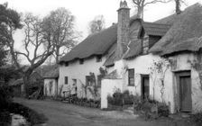 A pair of cottages with thatched roofs at Luccombe, Somerset, c1900. Artist: Farnham Maxwell Lyte