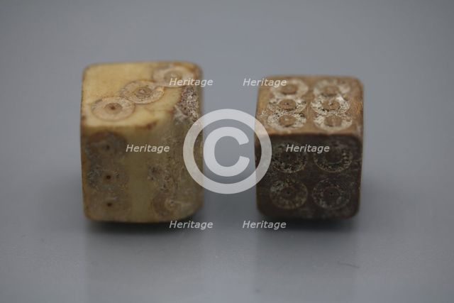 A pair of Roman dice made from carved bone, 1st century BC.