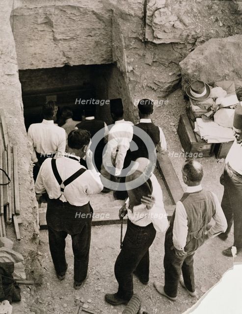 A party going down the steps to the tomb of Tutankhamun, Valley of the Kings, Egypt, 1923. Creator: Harry Burton.