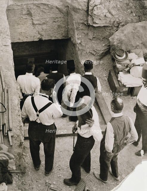 A party going down the steps to the tomb of Tutankhamun, Valley of the Kings, Egypt, 1923. Artist: Harry Burton