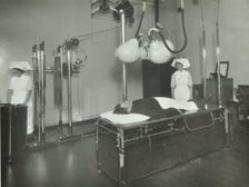 A patient undergoes a medical procedure, c1950s. Creator: Unknown