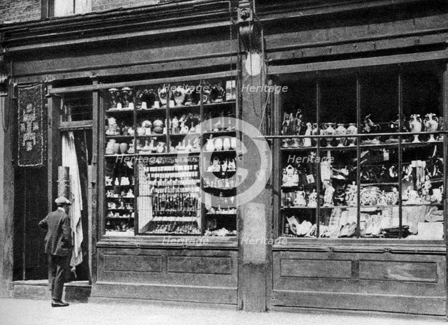 A pawnbroker's shop front, Bow, London, 1926-1927.Artist: Whiffin