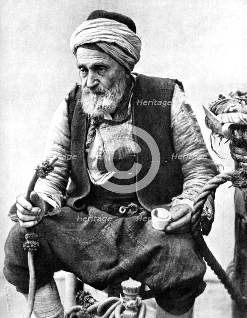 A peasant drinking coffee and smoking a huqqah, Izmir, Turkey, 1936. Artist: Unknown