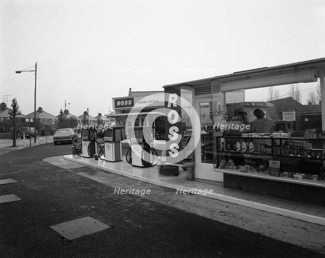 A petrol station forecourt, Grimsby, Lincolnshire, 1965.  Creator: Michael Walters.