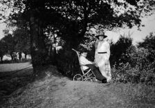A physically disabled boy sitting in a wheelchair, c1910/1925. Creator: Unknown