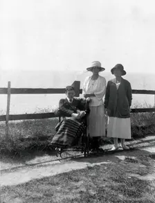 A physically disabled boy sitting in a wheelchair, c1910/1925. Creator: Unknown
