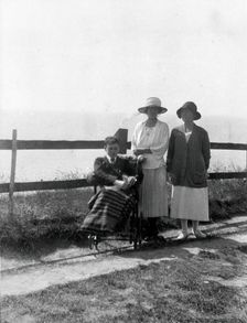 A physically disabled boy sitting in a wheelchair, c1910/1925. Creator: Unknown