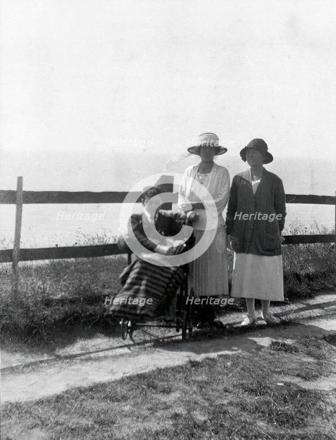 A physically disabled boy sitting in a wheelchair,  c1910/1925. Creator: Unknown.