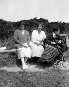 A physically disabled boy sitting in a wheelchair, c1910/1925. Creator: Unknown