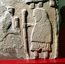 A Pict with hooded cloak & Pictish trousers, St.Vigeans, Scotland, c8th - 9th century