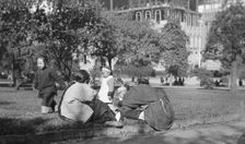 A picnic on Portsmouth Square, Chinatown, San Francisco, between 1896 and 1906. Creator: Arnold Genthe