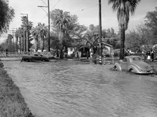 A Pontiac and a Willy's in a flood, USA, c1941