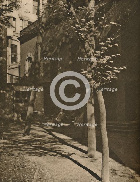 'A Pool of Quiet in "Streaming London's Central Roar", c1935. Creator: Walter Benington.