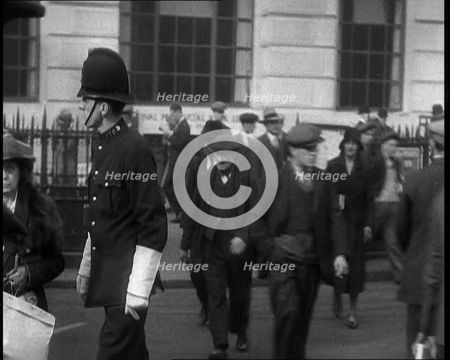 A Police Officer Guiding Traffic on the Streets of London, 1936. Creator: British Pathe Ltd.