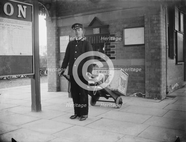 A porter at Charwelton Station, Northamptonshire, 1901. Artist: A Newton