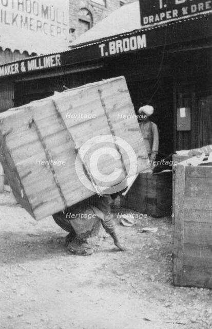 A porter lifting a large load, Chakrata, India, 1917. Artist: Unknown