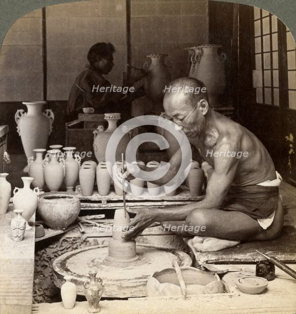 A potter and his wheel, fashioning a vase of Awata porcelain, Kinkosan works, Kyoto, Japan, 1904. Artist: Underwood & Underwood