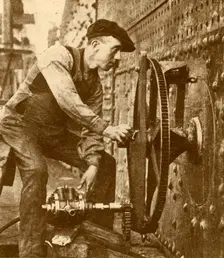 A Pneumatic Riveter Cutting Portholes in the Side of a Liner c1930. Creator: John Brown & Company