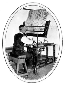 A preliminary to the weaving of figured goods: transferring a design to jacquard cards, 1909. Creator: Unknown