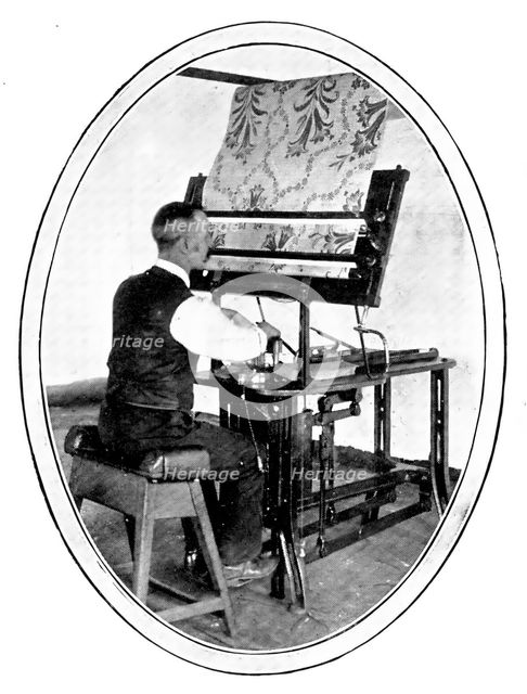 A preliminary to the weaving of figured goods: transferring a design to jacquard cards, 1909. Creator: Unknown.