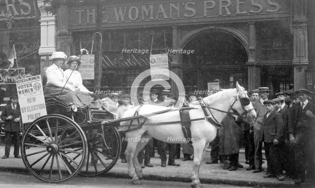A 'press cart' outside the Woman's Press, Charing Cross Road, London, July 1911. Creator: Unknown.