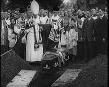 A Priest Waving Incense Over the Coffin of Terence MacSwiney During His Burial, 1920. Creator: British Pathe Ltd