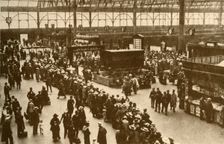A Queue of Holiday-Makers Waiting for Trains at Waterloo Station, London 1930. Creator: Alfieri