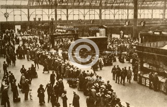 'A Queue of Holiday-Makers Waiting for Trains at Waterloo Station, London', 1930. Creator: Alfieri.