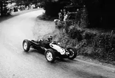 A racing driver speeding round a bend, Harleyford Hill Climb, Buckinghamshire, (c1950-c1960?)