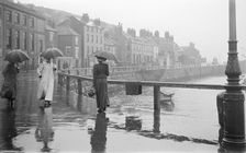 A rainy day on Pier Road, Whitby, North Yorkshire, 1896-1920. Artist: Alfred Newton & Sons