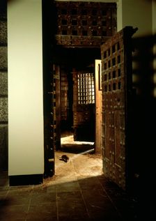A reconstruction of a corridor in Newgate Gaol, with original doors. Creator: Unknown