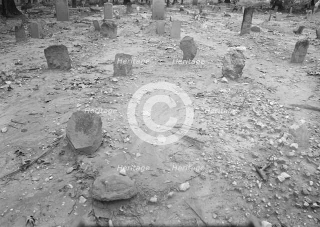 A red clay Negro cemetery, Bethel Hill High School, Person County, North Carolina, 1939. Creator: Dorothea Lange.