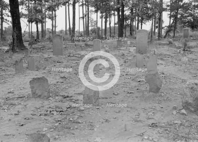 A red clay Negro cemetery, Bethel Hill High School, Person County, North Carolina, 1939. Creator: Dorothea Lange.
