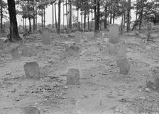A red clay Negro cemetery, Bethel Hill High School, Person County, North Carolina, 1939. Creator: Dorothea Lange