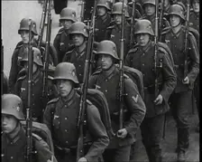 A Regiment of Male German Soldiers Marching Along a German Street, 1939. Creator: British Pathe Ltd