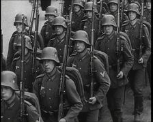 A Regiment of Male German Soldiers Marching Along a German Street, 1939. Creator: British Pathe Ltd