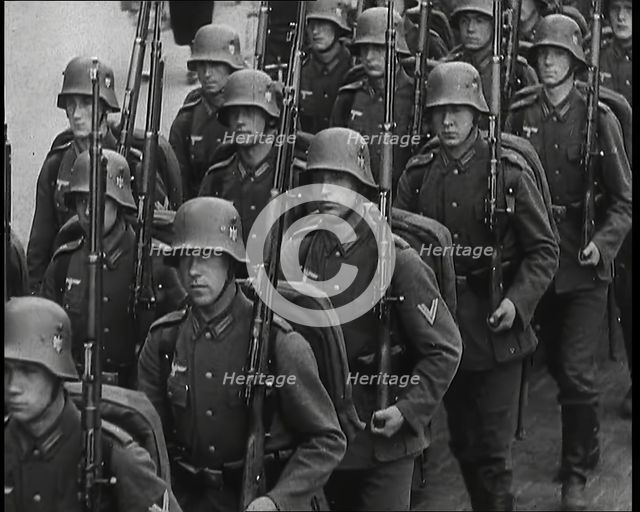 A Regiment of Male German Soldiers Marching Along a German Street, 1939. Creator: British Pathe Ltd.