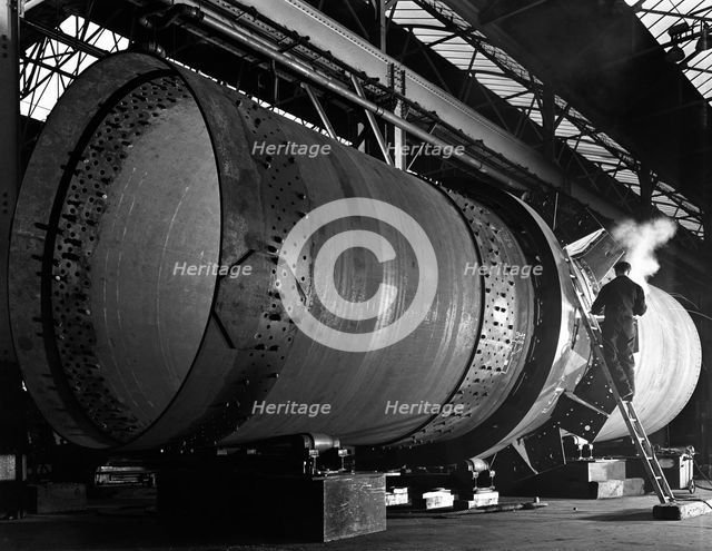 A rotary kiln section being welded in preparation for installation, Steetley, Nottinghamshire, 1962. Creator: Michael Walters.